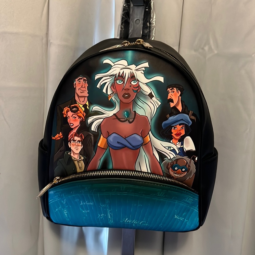 Disney backpack from the movie Atlantis black also have the matching wallet.